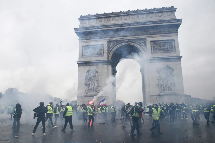 Paris, France. 1st December 2018. Riot Police use tear gas against demonstrators during a protest by people wearing yellow vests. ?w=200&h=150