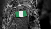 Flag of Nigeria on soldiers arm.