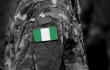 Flag of Nigeria on soldiers arm.