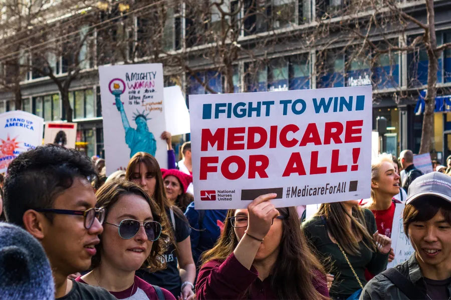 January 19, 2019 San Francisco / CA / USA - Participant to the Women's March event holds "Medicare for all" sign while marching on Market street in downtown San Francisco. ?w=200&h=150
