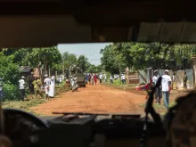 Soldiers patrolling on streets of Bangui, Central African Republic. View from inside military vehicle. 