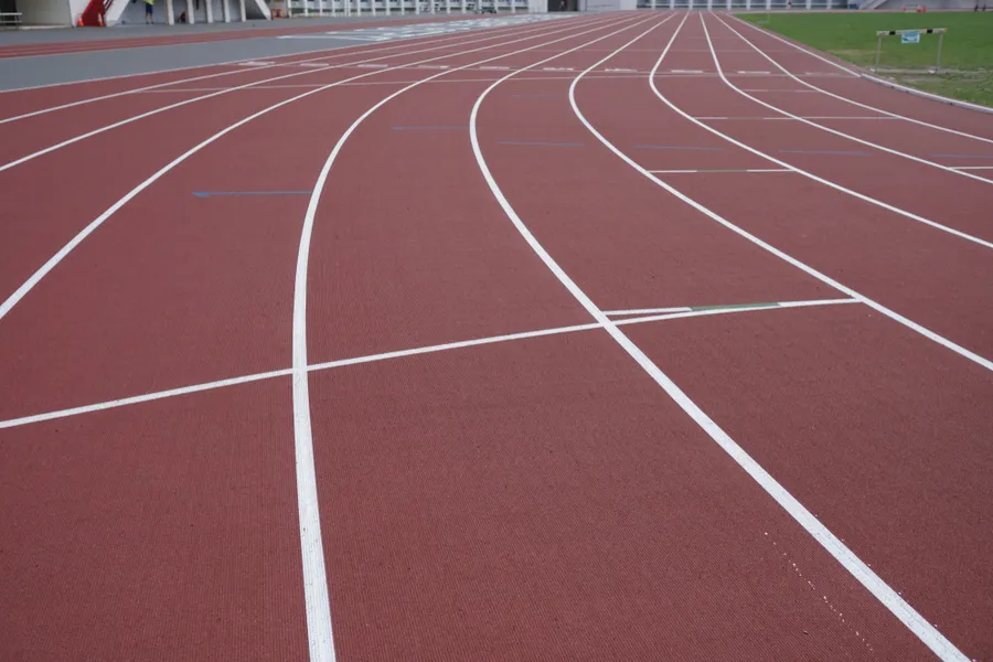 Track lanes in a stadium. Via Shutterstock?w=200&h=150