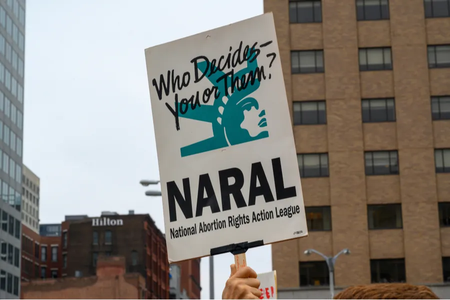activist carrying a NARAL (National Abortion Rights Action League) sign at a pro abortion rally. ?w=200&h=150