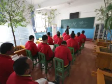 Uighurs learn gardening at "reeducation camp" in Moyu County, Hotan Prefecture in Xinjiang. 