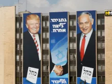 Banner for the Likud party showing President Donald Trump shaking hands with Prime Minister Benjamin Netanyahu on a building in Jerusalem. 