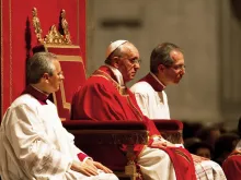 Pope Francis praying during an evening Good Friday service in St Peter's Basilica, 2013. 