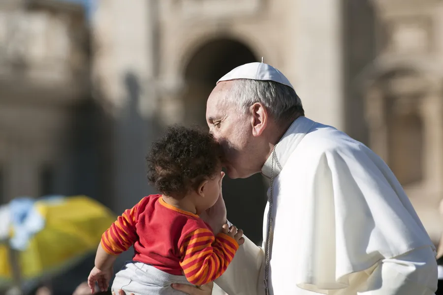 Pope Francis on the popemobile kiss child in St. Peter's Square. ?w=200&h=150