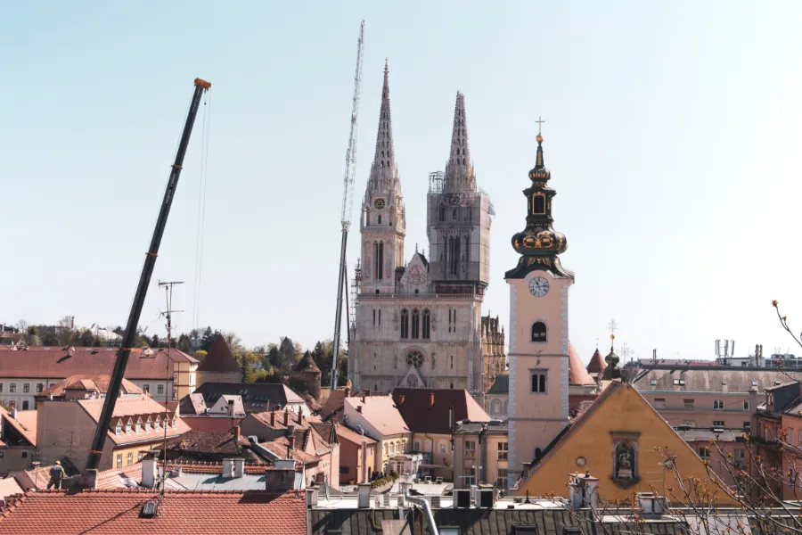 A crane removes an earthquake-damaged tower at Zagreb Cathedral in Croatia April 9, 2020. Credit: Miroslav Posavec via Shutterstock.?w=200&h=150