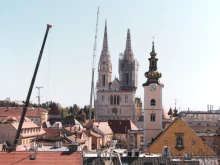 A crane removes an earthquake-damaged tower at Zagreb Cathedral in Croatia April 9, 2020. Credit: Miroslav Posavec via Shutterstock.