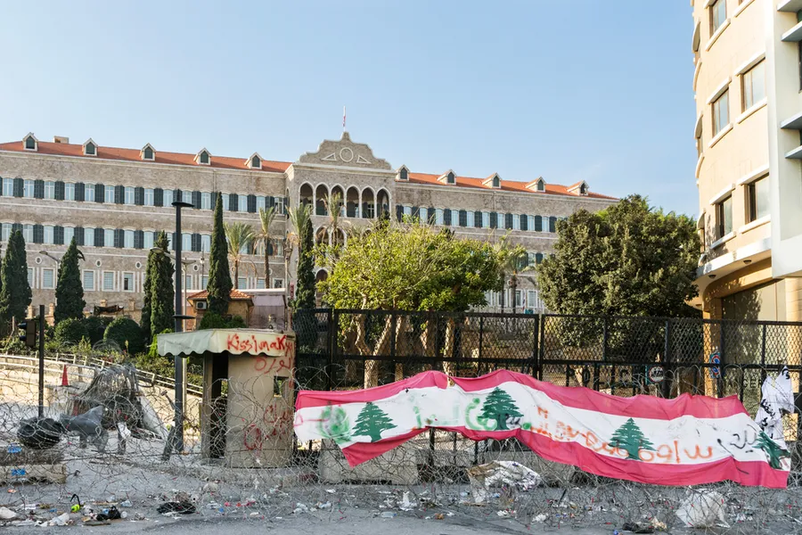 Lebanese flag on barbed wire in front of the Lebanese government seat of Grand Serail. ?w=200&h=150