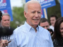 Joe Biden walking with supporters in Iowa, May 25, 2020. 