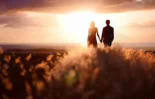 Couple at sunset, Via Shutterstock.