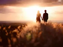 Couple at sunset, Via Shutterstock.