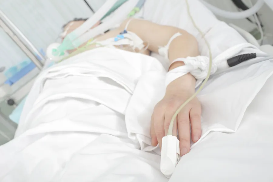 Patient in a hospital bed. Via Shutterstock?w=200&h=150