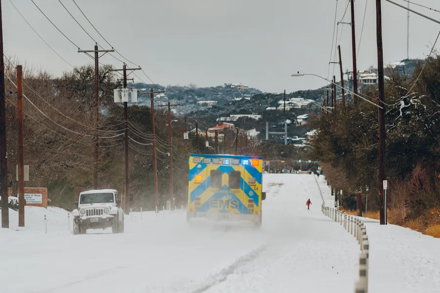 An ambulance drives amid snow in Austin, Texas, Feb. 16, 2021. Credit: ChangJr LIN/Shutterstock.?w=200&h=150