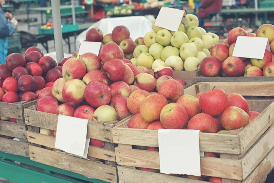 Crates of apples in a market. Image via Shutterstock.?w=200&h=150