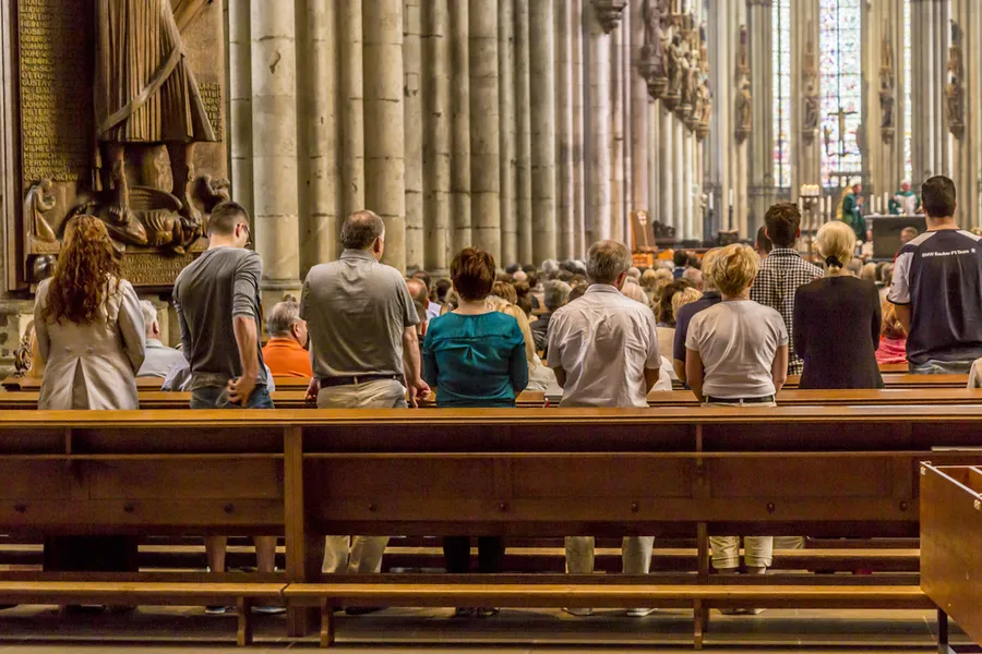 People in the pews at Cologne Cathedral, Germany. ?w=200&h=150