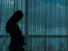 Silhouette of pregnant woman. 