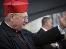 Timothy Cardinal Dolan Archbishop of New York waves to parade marchers in front of St Patricks Cathedral on Saint Patricks Day in Manhattan on March 17, 2016. 