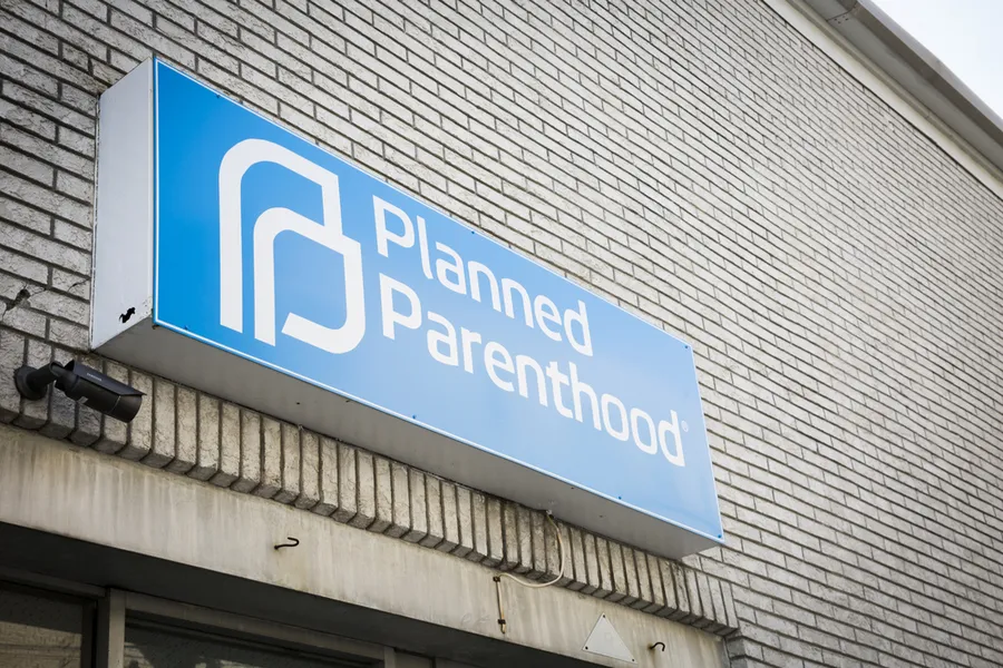 Blue and white sign above the entrance for the Planned Parenthood clinic in Newton, NJ. Via Shutterstock.?w=200&h=150