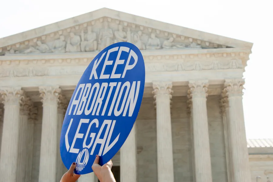 A Pro-choice activist holds a sign in front of the Supreme Court in Washington, DC on June 27, 2016. ?w=200&h=150