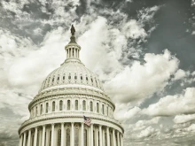 US Capitol dome with clouds. 