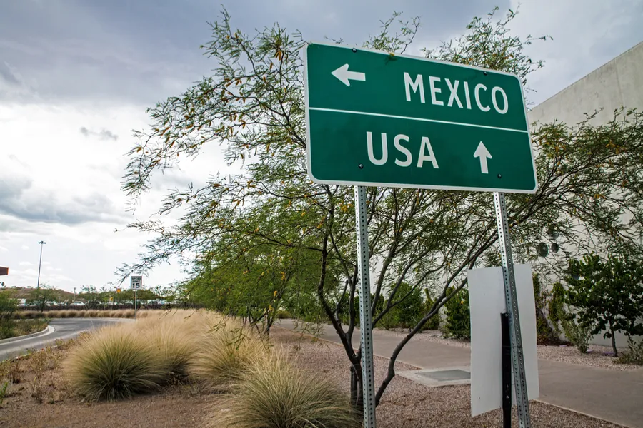 Signpost at the US-Mexican border. ?w=200&h=150