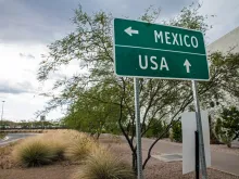 Signpost at the US-Mexican border. 