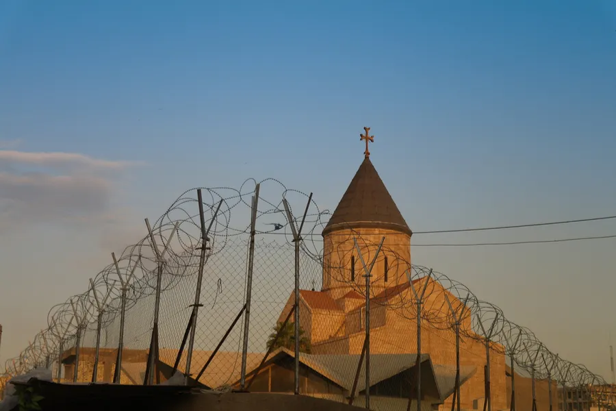 Armenian church behind barbed wire, Baghdad, Iraq. Via Shutterstock.?w=200&h=150