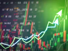 Stock market digital graph chart on LED display concept. Via Shutterstock