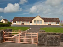 Photo of a rural school building in Ireland. Via Shutterstock