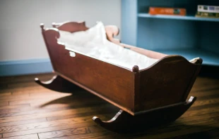 Empty cradle. Stock image via Shutterstock.