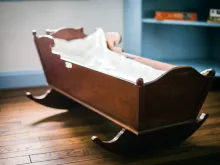 Empty cradle. Stock image via Shutterstock.