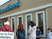 Pro-life volunteers pray outside a Planned Parenthood facility in 2017. 