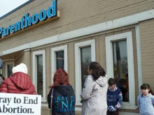 Pro-life volunteers pray outside a Planned Parenthood facility in 2017. 
