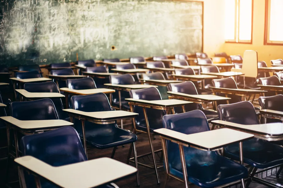 Wooden row lecture chairs in classroom. Via Shutterstock?w=200&h=150