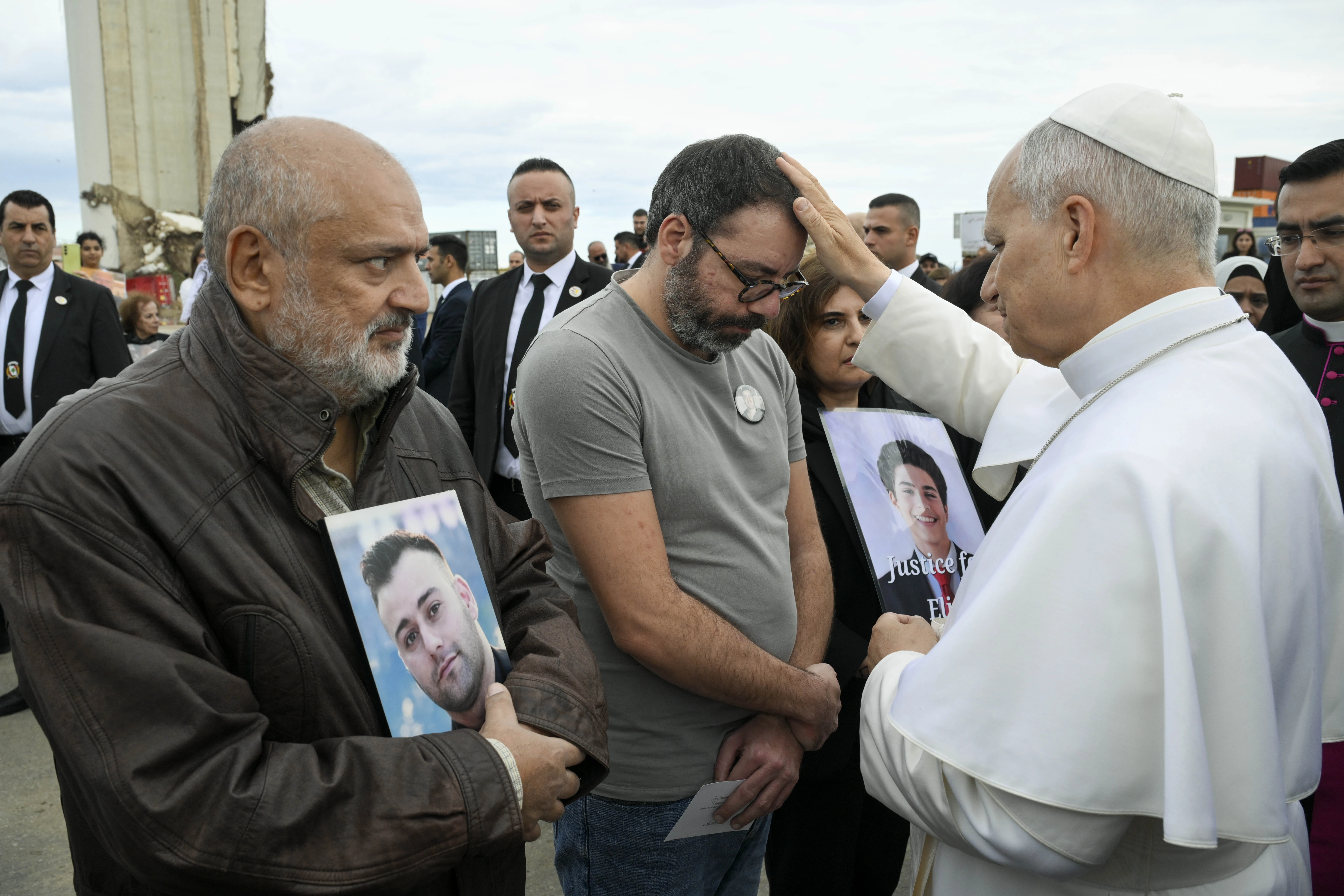 Pope Leo XIV blesses a man seeking justice for a family member lost in the 2020 Beirut port explosion during a stop at the site of the blast on Dec. 2, 2025. | Credit: Vatican Media.