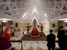 The body of Pope Francis lies in state at the Vatican's Domus Sanctae Marthae chapel, surrounded by Swiss Guards, cardinals, and Vatican officials paying their respects before his transfer to St. Peter’s Basilica for public veneration on April 22, 2025. The mortal remains of Pope Francis will be transferred to St. Peter’s Basilica on Wednesday, April 23.