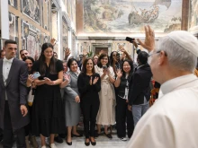 Pope Leo XIV greets participants attending the Oct. 1-3 Migrants and Refugees in Our Common Home summit in Rome on Thursday, Oct. 2, 2025.