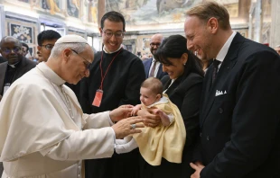Pope Leo XIV greets a baby during an audience with the Pontifical John Paul II Institute for Studies on Marriage and the Family at the Vatican on Friday, Oct. 24, 2025. Credit: Vatican Media