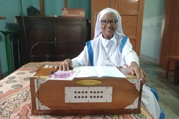 Sister Mary Amiya plays her Harmonium at Shanti Bhabon in Gazipur, Sept. 27, 2025.