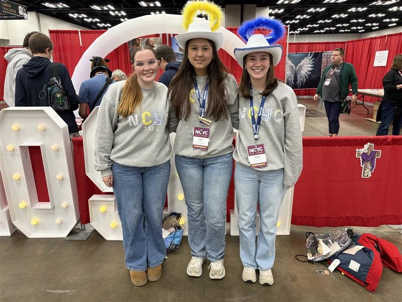 Lucy Snipes, Anne Young, and Presley Hilderbrand from Columbus, Georgia tour exhibits during the first night of NCYC 2025 on Nov. 20, 2025, at the Indiana Convention Center in Indianapolis.?w=200&h=150
