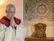 Fr. Arturo Sosa, Superior General of the Society of Jesus, prepares to say Mass at the Gesu in Rome, Oct. 15, 2016. 