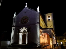 The outside of the reconstructed Basilica of St. Benedict in Norcia, Italy, is lit up with lights in celebration of its reopening on Oct. 30, 2025.