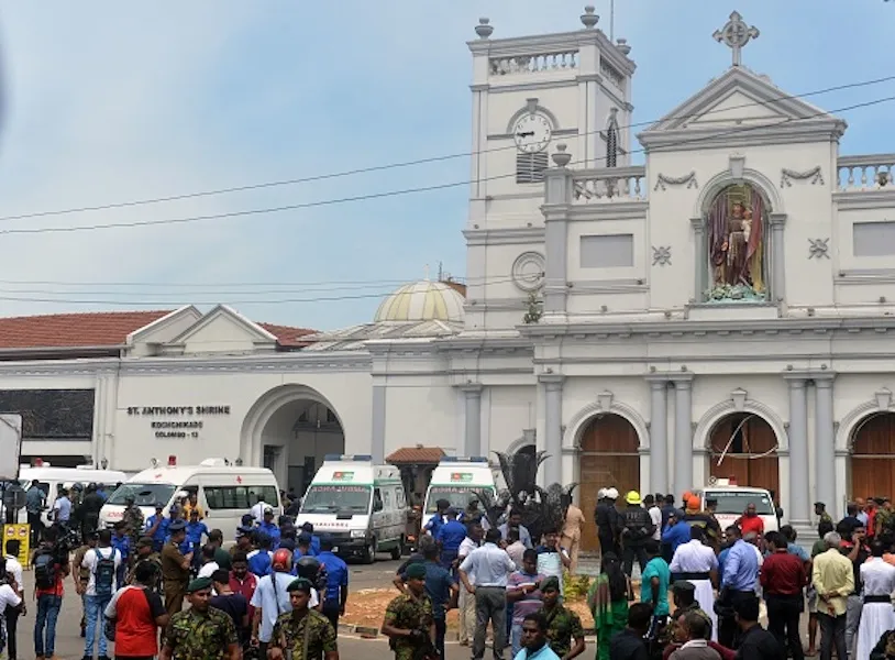 Ambulances are seen outside the church premises with gathered people and security personnel following a blast at the St. Anthony's Shrine in Kochchikade, Colombo on April 21, 2019. ?w=200&h=150