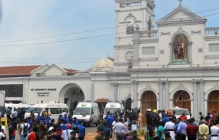 Ambulances are seen outside the church premises with gathered people and security personnel following a blast at the St. Anthony's Shrine in Kochchikade, Colombo on April 21, 2019. ISHARA S. K