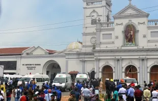 Ambulances are seen outside the church premises with gathered people and security personnel following a blast at the St. Anthony's Shrine in Kochchikade, Colombo on April 21, 2019. ISHARA S. K