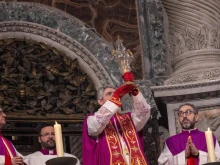A canon of Saint Peter elevates the relic of the Holy Lance one last time before returning it to its chapel on Feb. 24, 2024.