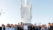 The statue of Pope Leo in Chiclayo, Peru, is surrounded by some of the people who attended its inauguration and blessing.