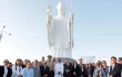 The statue of Pope Leo in Chiclayo, Peru, is surrounded by some of the people who attended its inauguration and blessing.